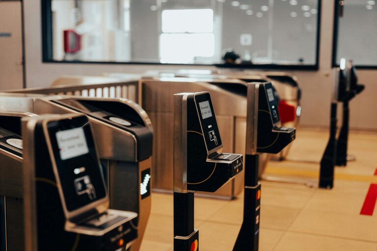 Electronic ticket turnstiles in a Ho Chi Minh City transit station, showcasing modern technology.